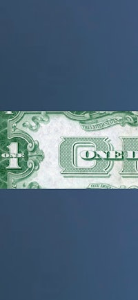 a green dollar bill on a blue background